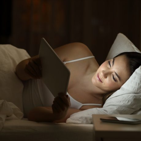 Relaxed,Girl,Using,A,Tablet,To,Watch,Media,Content,On