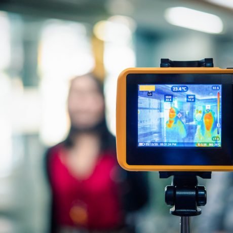 People waiting for temperature check by thermoscan Asian people waiting for body temperature check before access to building for against epidemic flu covid19 or corona virus from wuhan in office by thermoscan or infrared thermal camera